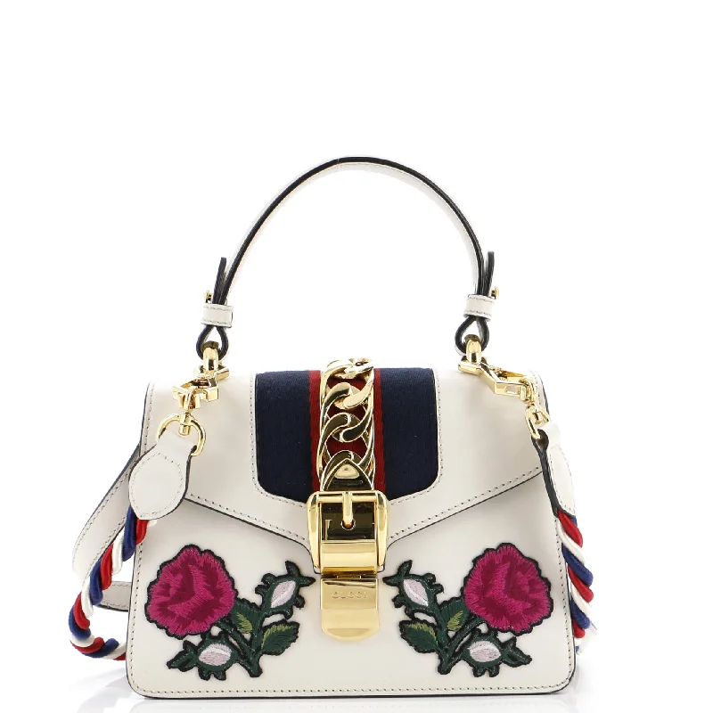 Printed Silk Shoulder Bag in Red for a Pop of ColorSylvie Top Handle Bag Embroidered Leather Mini Printed Silk Shoulder Bag in Red for a Pop of ColorSylvie Top Handle Bag Embroidered Leather Mini